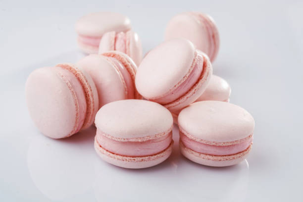 istock Pink colored. Bunch of macarons on the white surface 2170926334
