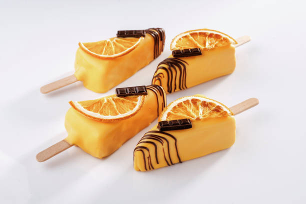 istock Orange fruit and chocolate. Cheesecake that looks like ice cream. Against white background 2170926401