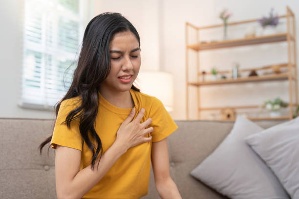 istock Concerned young woman dealing with chest pain 2170929415