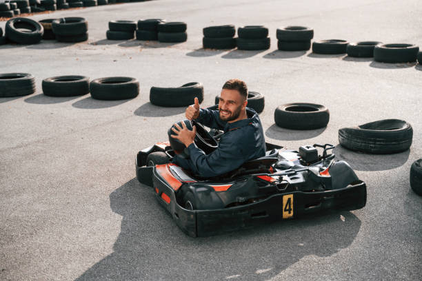 istock Looks behind while riding. Man is outdoors, kart racing conception 2170930177