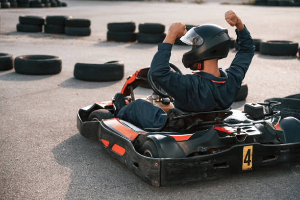 istock Celebrating victory. Man is outdoors, kart racing conception 2170930365