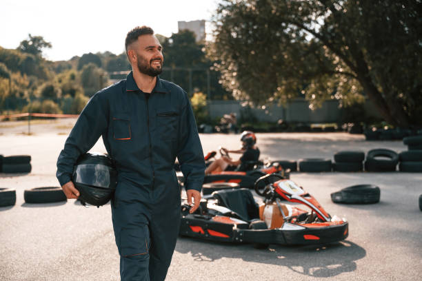 istock Standing against vehicle and trees. Man is outdoors, kart racing conception 2170930407