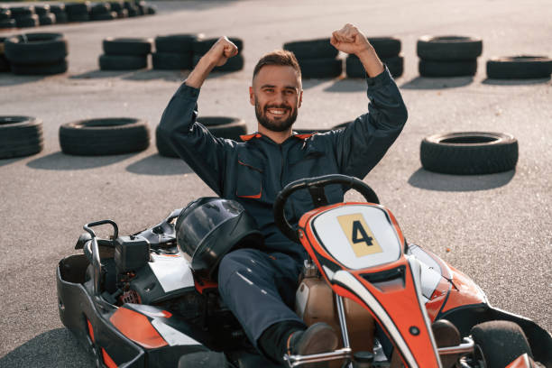istock Celebrating victory. Man is outdoors, kart racing conception 2170930484