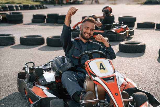 istock Celebrating victory. Man is outdoors, kart racing conception 2170930488