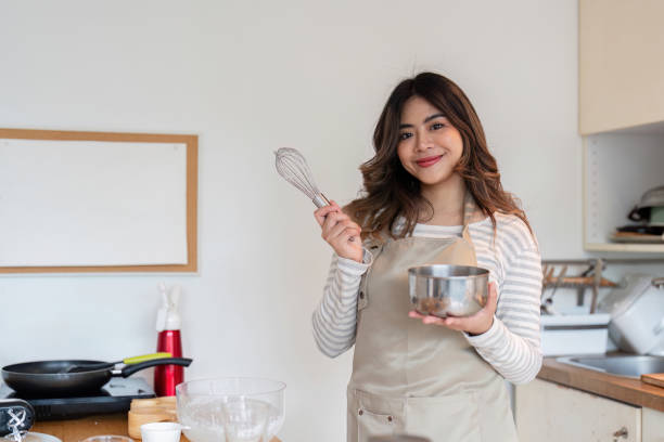 istock Confident baker ready to whisk ingredients in a home kitchen 2170930602