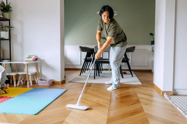 istock Handsome man cleaning floor at home 2170931031