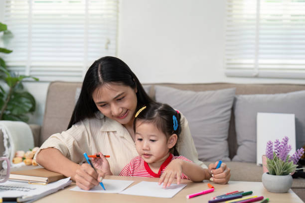 istock Mother and daughter engaged in a drawing session 2170931130