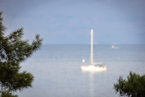 The boat is sailing on Adriatic Sea in cloudy weather.Hvar Island - Croatia.