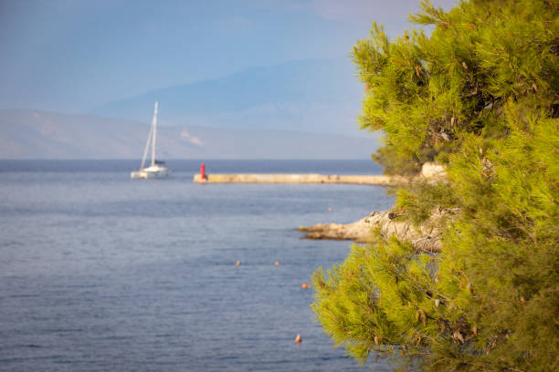 The boat is sailing on Adriatic Sea in cloudy weather.Hvar Island - Croatia.