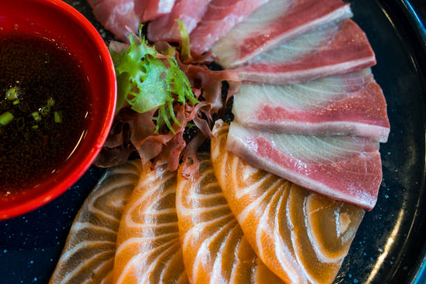 istock Fresh thinly slice of salmon sashimi, Accompanied with shoyu sauce 2170931706