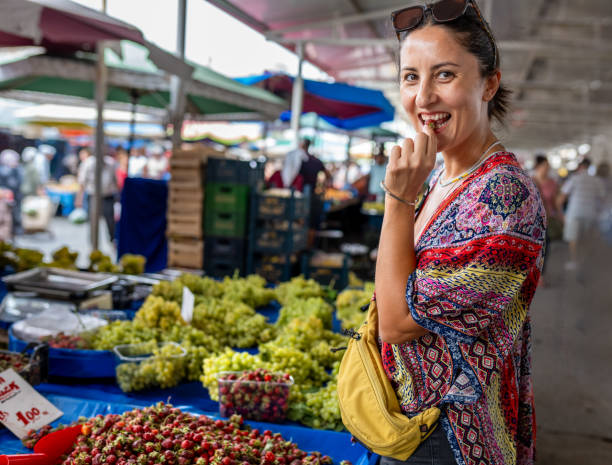 istock Beautiful woman tasting organic strawberries 2170933155