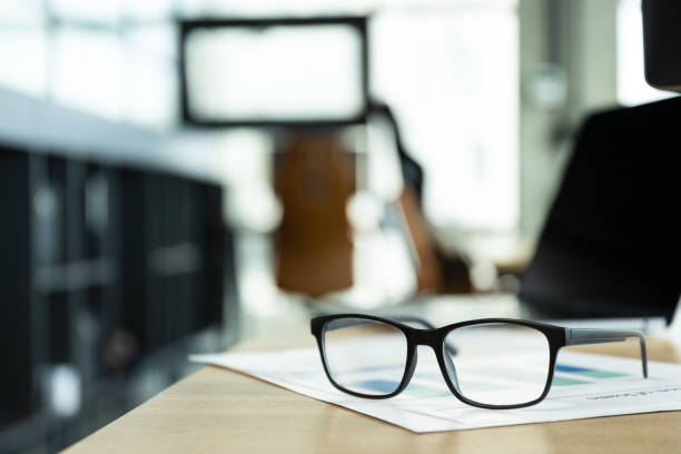 istock Glasses lying on papers in office, work in office concept 2170936222