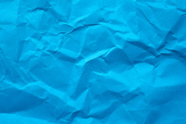 istock Full frame shot of crumpled blue  paper sheet texture and background. 2170936921