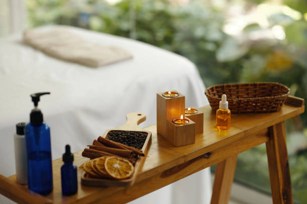 istock Relaxing Spa Setting with Lit Candles and Aromatherapy Oils 2170937116
