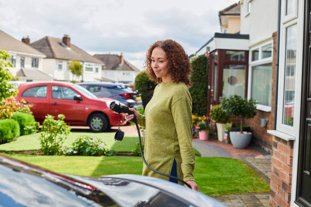 istock charging the electric car at home 2170943649