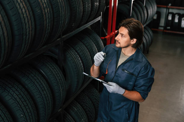 istock Collecting information, counting, notepad. Man is in the tire fitting car service 2170943795