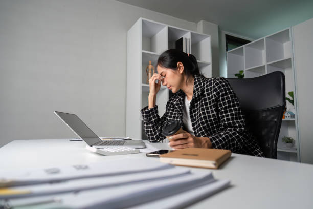 istock Stressed Young Businesswoman Overwhelmed by Workload in Modern Office Environment 2170946304