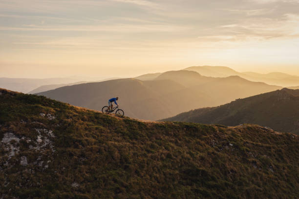 istock Mountain biker riding downhill in mountain. 2170946355