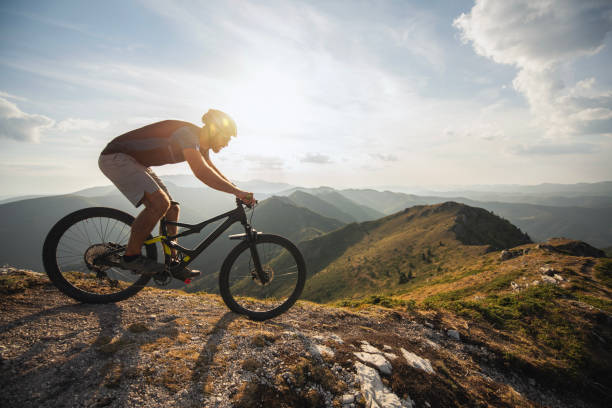 istock Mountain biker riding downhill in mountain. 2170946358