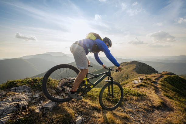 istock Mountain biker riding downhill in mountain. 2170946359
