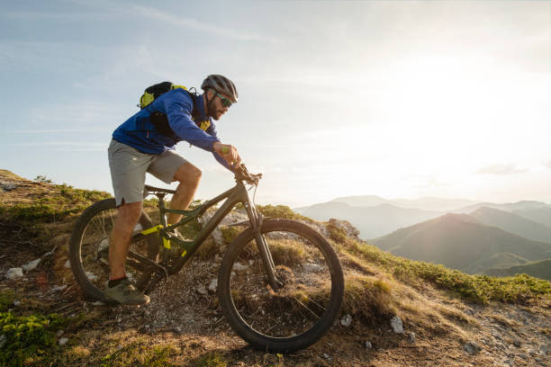 istock Mountain biker riding downhill in mountain. 2170946366