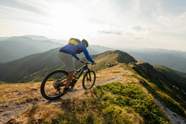 istock Mountain biker riding downhill in mountain. 2170946372