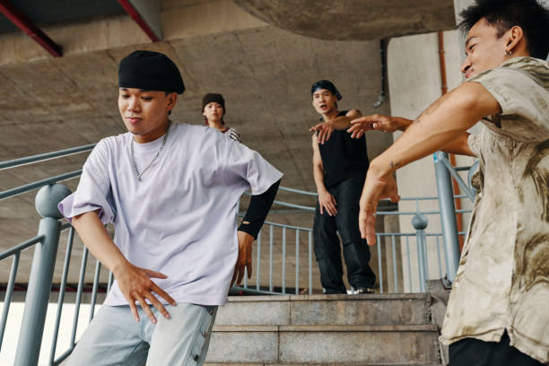 istock Dancing Group Practicing Hip-Hop Moves Outdoors 2170946826