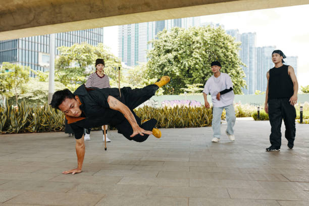istock Group of Breakdancers Performing Complex Moves Outdoors 2170947472