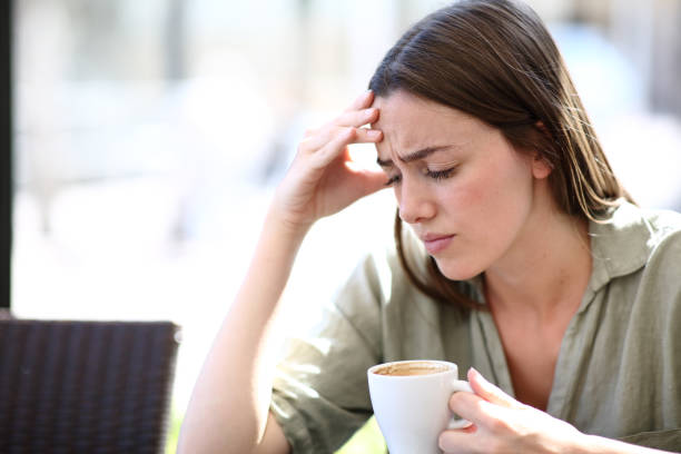 istock Worried woman drinking coffee in a bar interior 2170948072