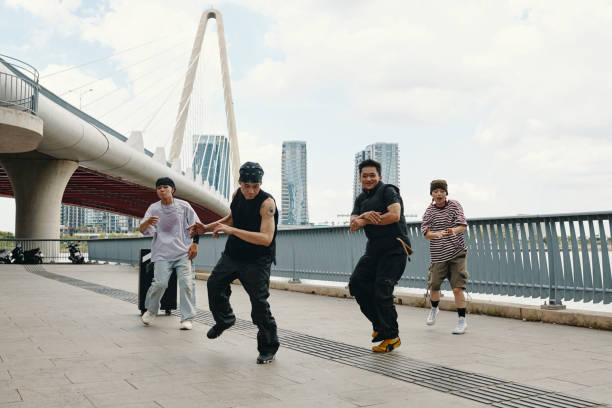 istock Dancing Outdoors beside Modern Bridge on Sunny Day 2170948171