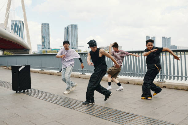 istock Dancing Group Performing Hip-Hop Routine Outdoors 2170948263