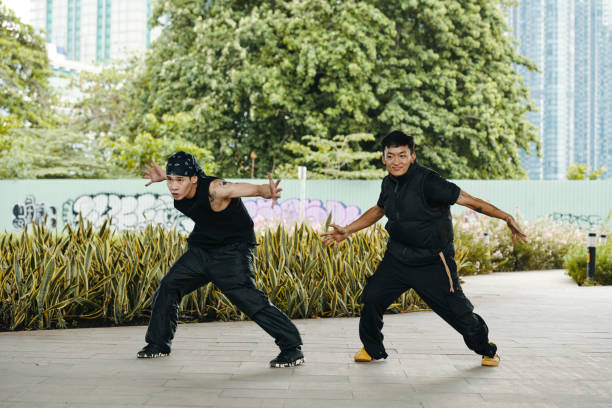 istock Practicing Martial Arts Moves in Urban Park 2170948595