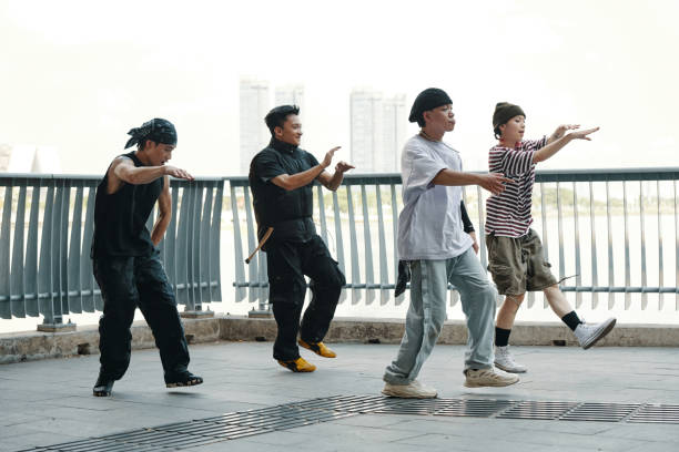 istock Young Men Performing Dance Moves Outdoors 2170949331