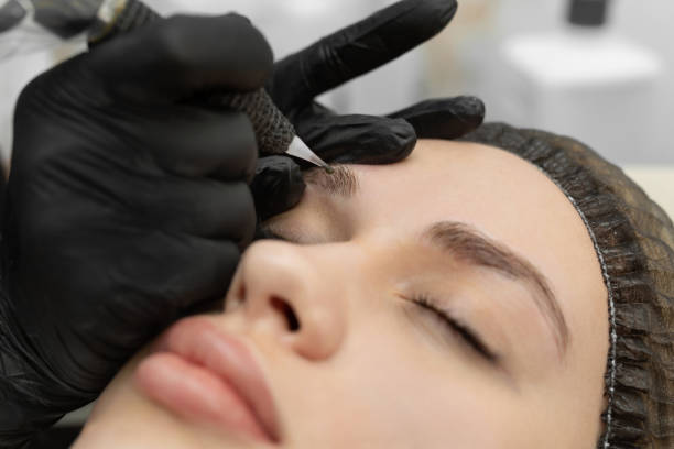 istock The cosmetologist performs the procedure of permanent makeup of the eyebrows 2170949368