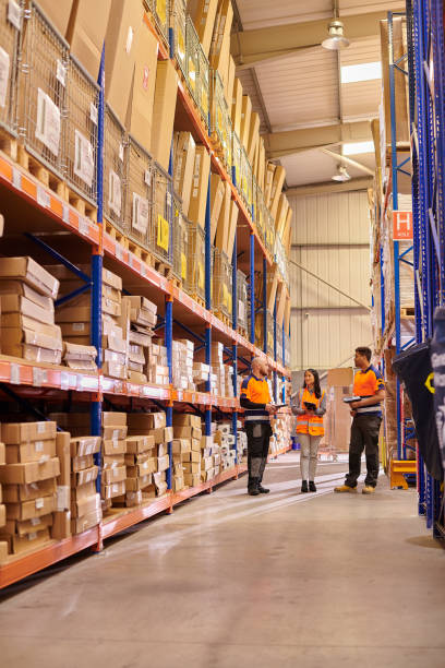 istock warehouse team discussion in the aisle 2170952153