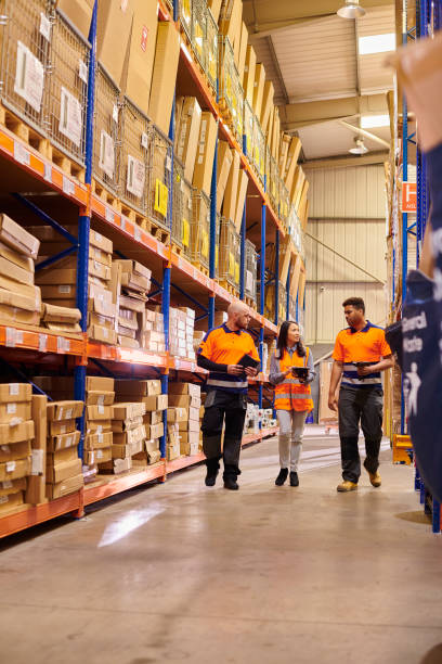 istock warehouse team walking in the aisle 2170952198