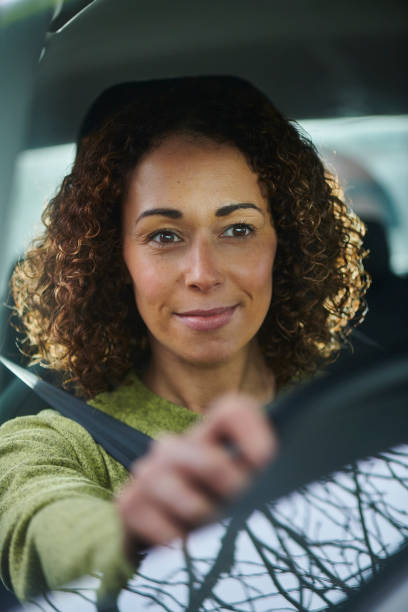 istock woman driving car 2170953899