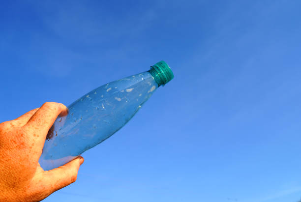 istock Plastic bottle on blue sky background. Plastic recycling and waste collection. 2170959106