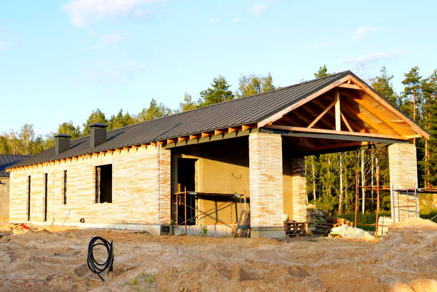 Villa construction. Prefab house under construction. Suburban house Construction. Prefabricated home building. Building a Family Home. View on construction site with Modular house building in suburb.