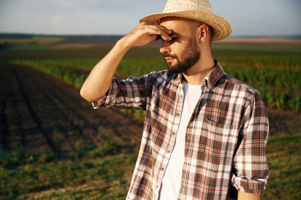 istock Tired, feeling bad. Farmer is on the agricultural field 2170960113