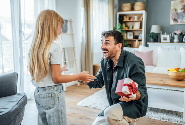 istock Excited father received a gift from his daughter 2170960949