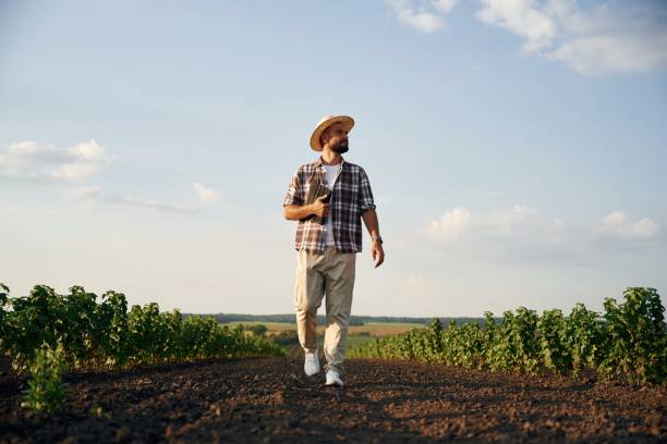 istock Front view, walking forward. Farmer is on the agricultural field 2170961622