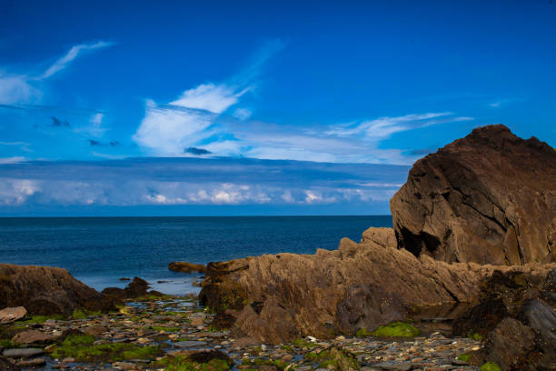 Ilfracombe's rocky coastline. Summer, beautiful skies, sunshine, relaxation, holiday, beach, time to think, time to eat, the beauty of nature.