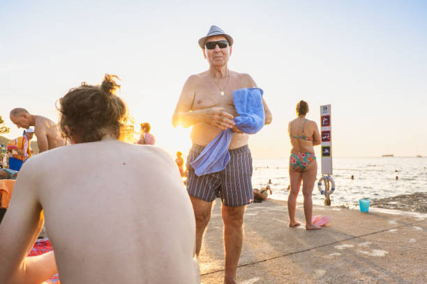 One active senior man spending Summer evenings at the beach