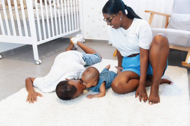 istock Parents playing with baby on nursery floor 2170969128
