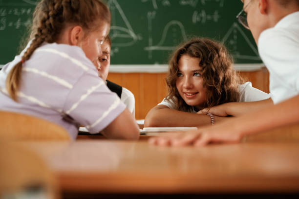 diverse muslim children studying in classroom