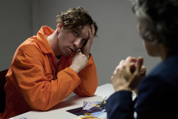 istock Pensive Male Inmate in Conversation with Another Person 2170970694