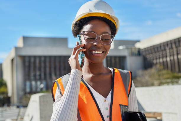 istock Confident Female Engineer in Hard Hat Using Smartphone Outdoors 2170971262