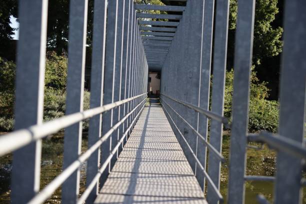 istock Perspective view of a metal pedestrian bridge 2170972420