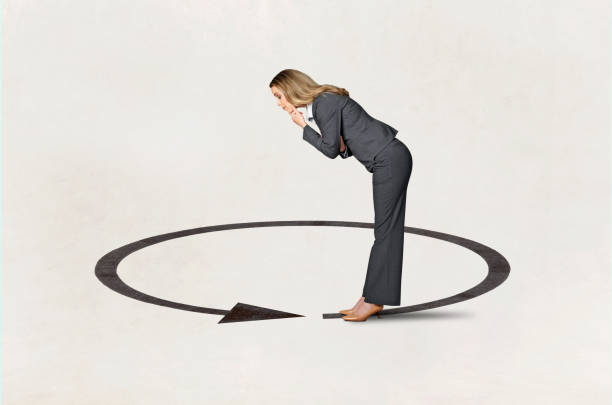 istock Woman Looking Down At Arrow That Circles Around Her 2170982137